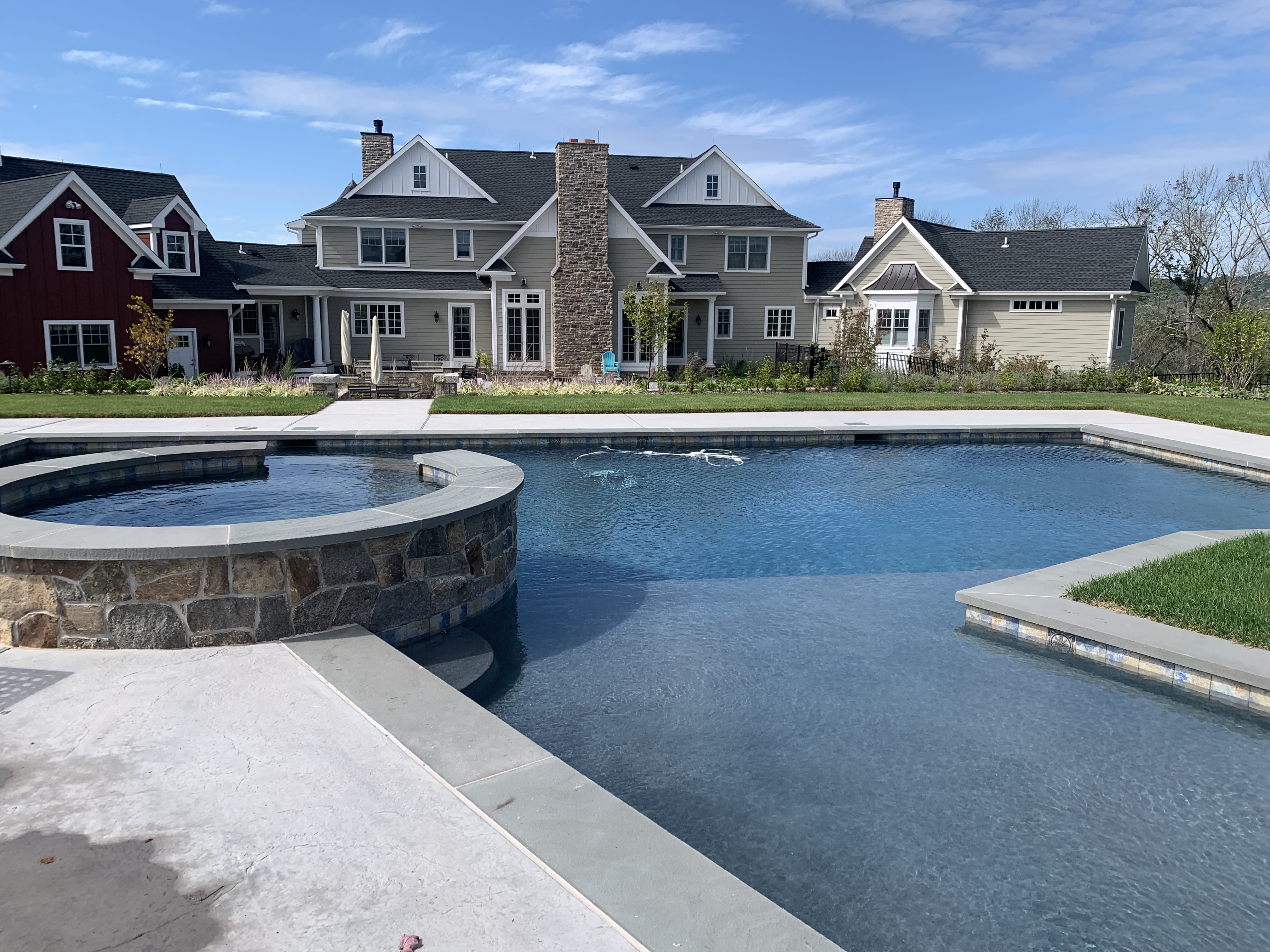 Rectangle pool with raised stone spa
